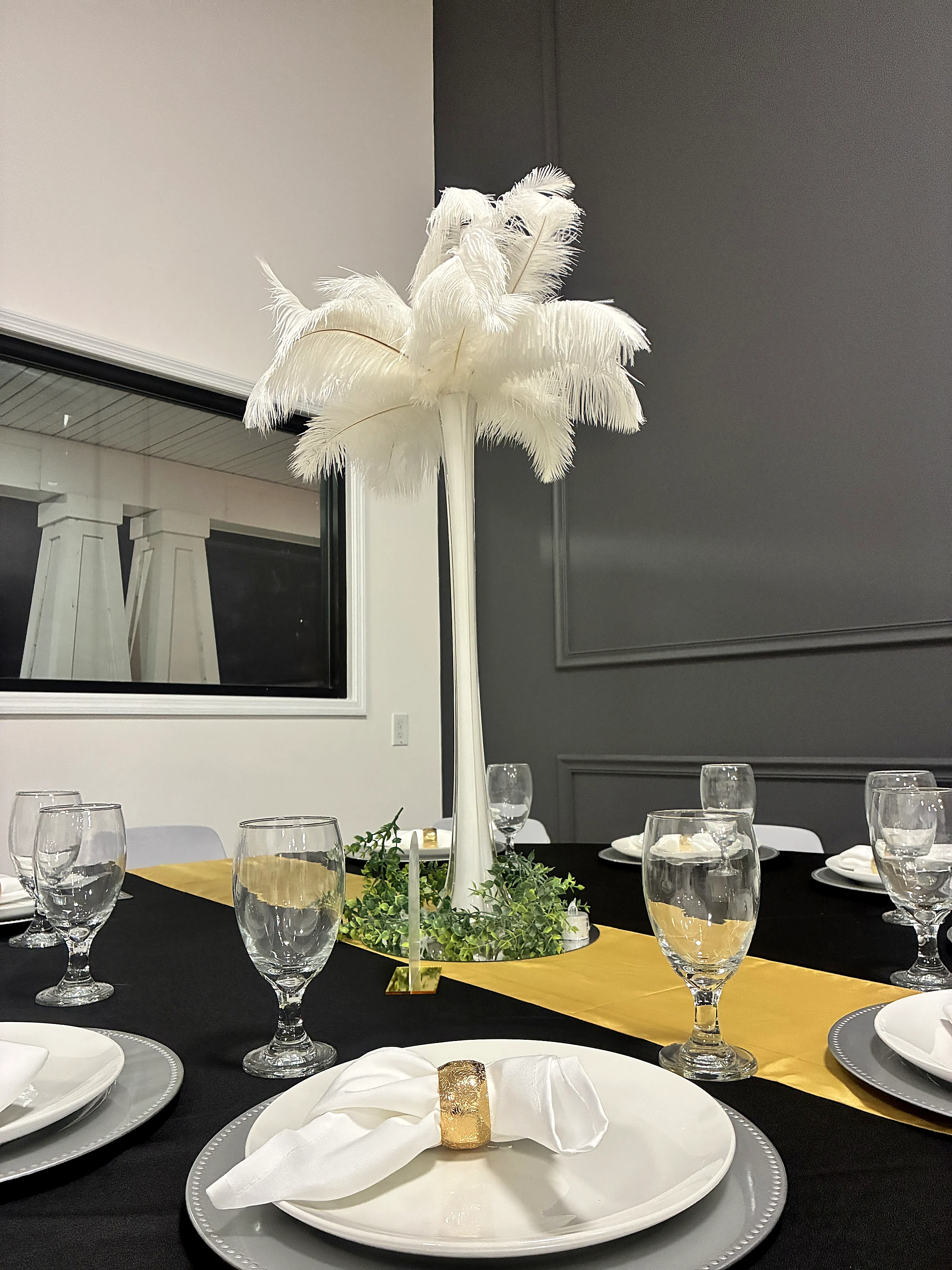 Feather centerpiece on a black table
